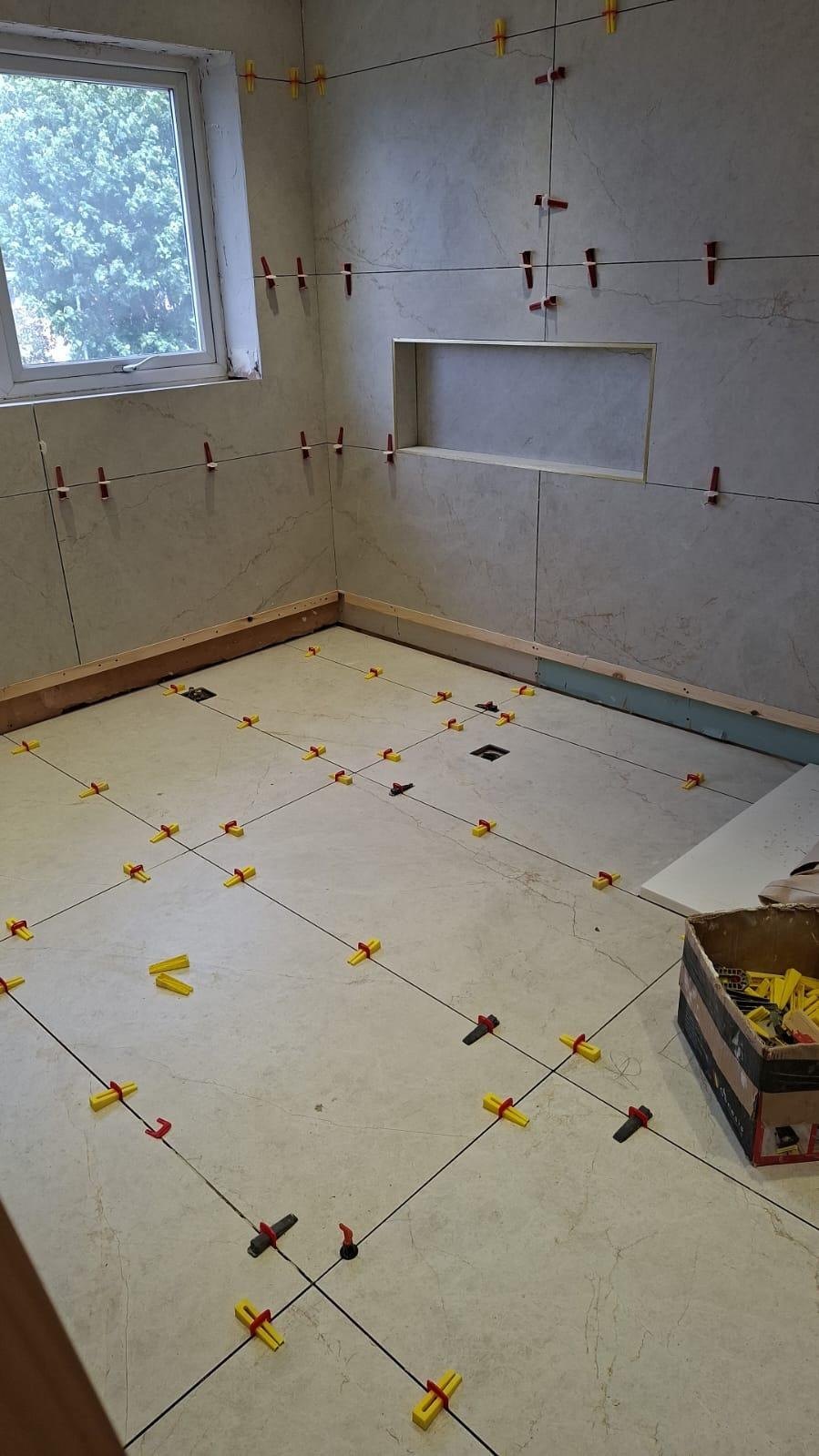 New bathroom being tiled