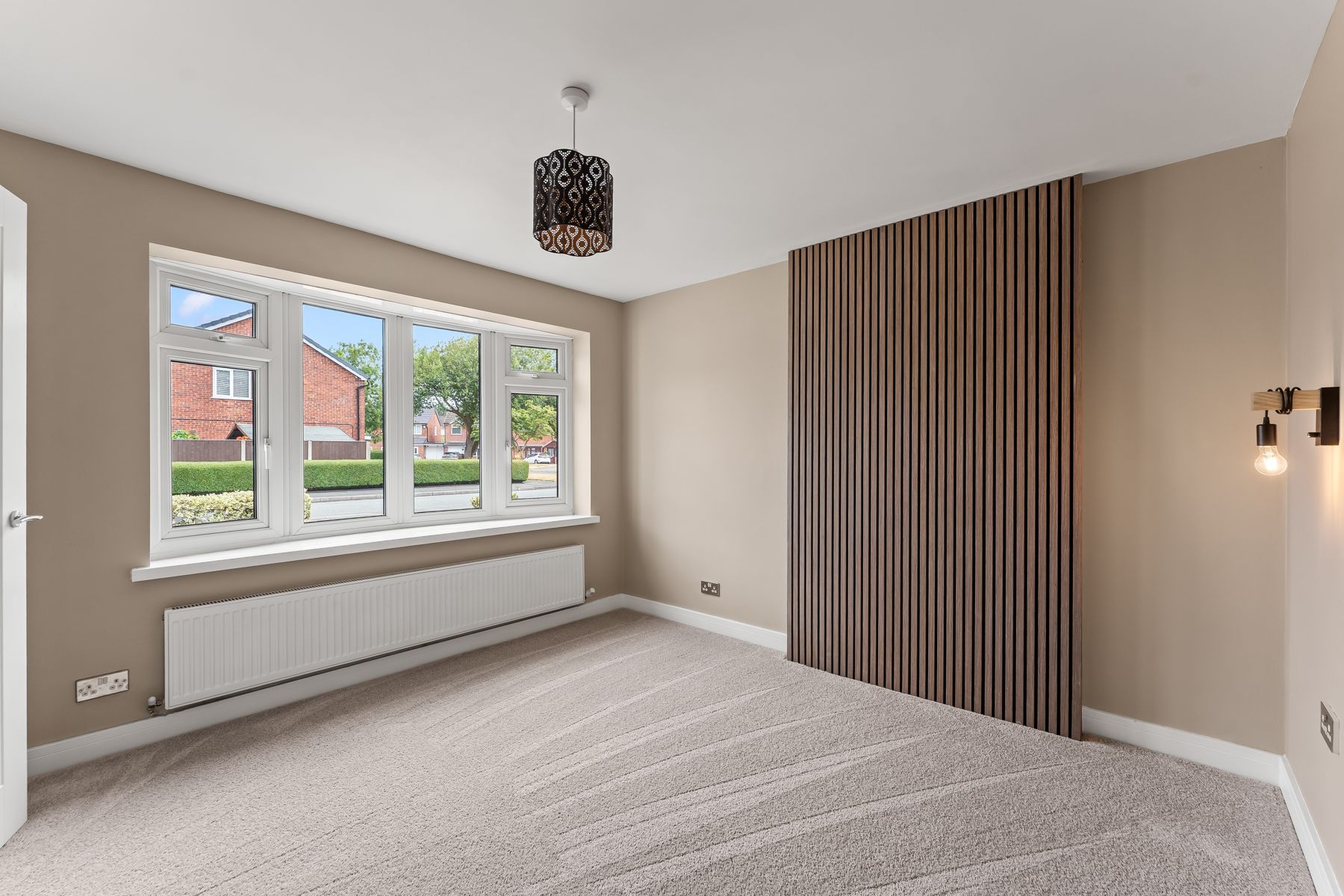 Bedroom with feature wall after